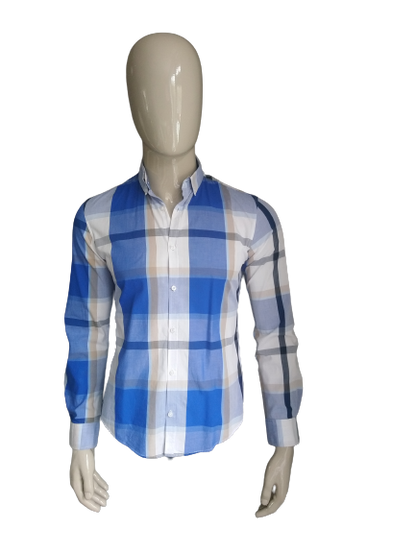 We fashion shirt. Blue black brown white checkered. Size M.