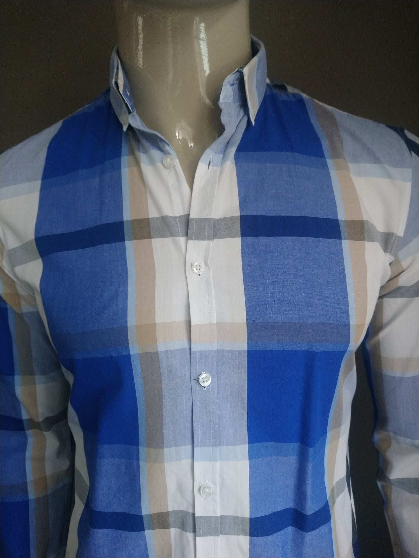 We fashion shirt. Blue black brown white checkered. Size M.