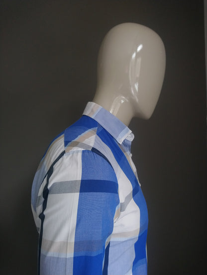 We fashion shirt. Blue black brown white checkered. Size M.