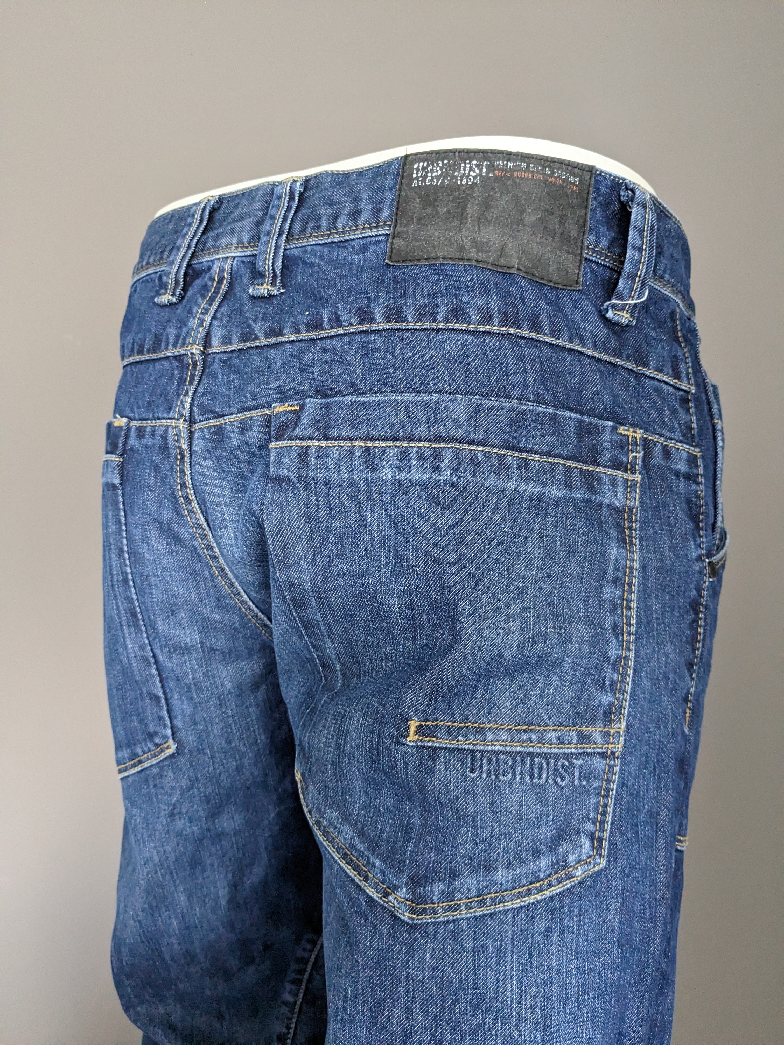 Urban district 3/4th shorts of jeans fabric. Dark blue colored