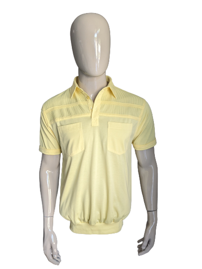 Polo de Canda Vintage con banda elástica. Color amarillo. Talla M.