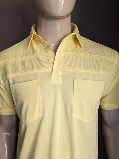 Polo de Canda Vintage con banda elástica. Color amarillo. Talla M.