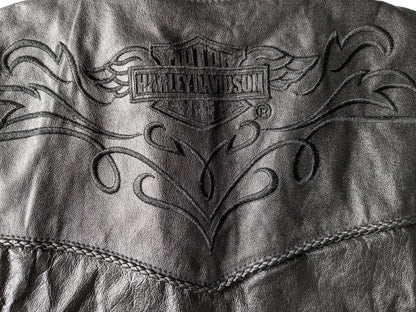 Harley Davidson Leather waistcoat. Black with beautiful braided edges and beautiful applications. Black. Size XXS.