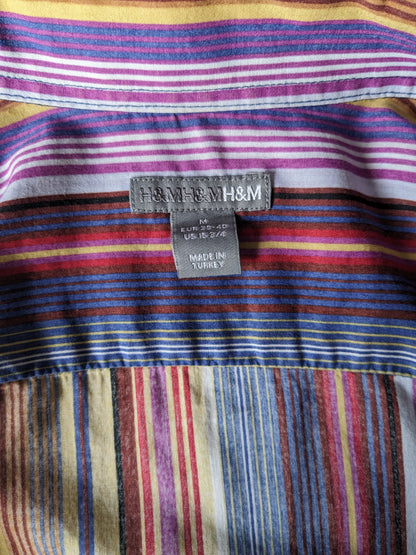 H&M shirt. Purple brown yellow red striped. Size M.