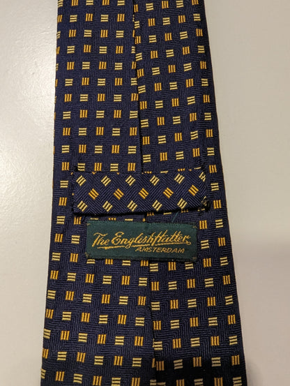 La corbata de seda de sombrerero inglés. Motif amarillo azul.