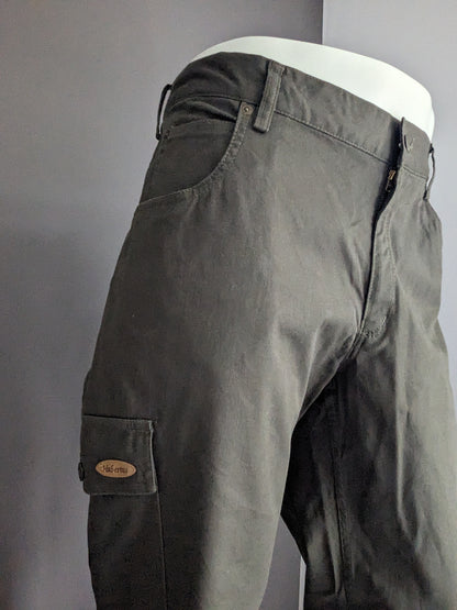 Hubertus Hunting Broek with a pocket side. Dark green colored. Size 29 (58 / XL-2XL)