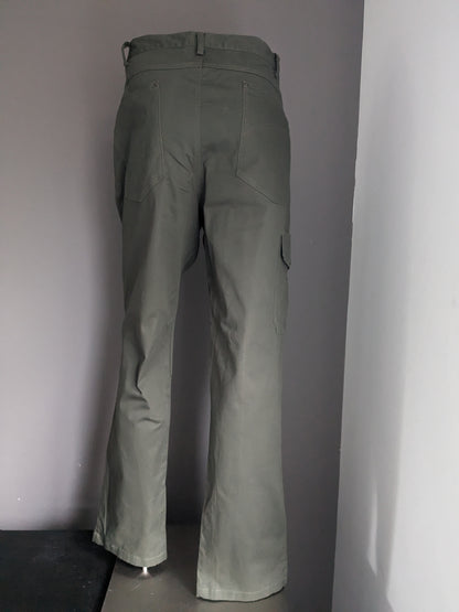 Hubertus Hunting Broek with a pocket side. Dark green colored. Size 29 (58 / XL-2XL)