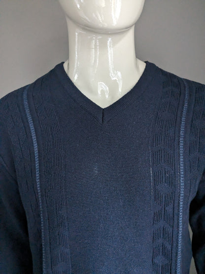 Pull à câble de look vintage. Couleur bleu foncé. Taille M.