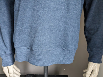 Pull Burton avec col sportif. Bleu foncé mélangé. Taille L.