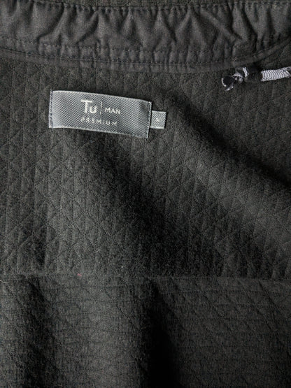 TU premium man shirt with press studs. Dark gray tangible motif. Size M.