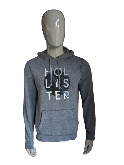 Hollister Hoodie. Donker Grijs gemêleerd met opdruk. Maat M.