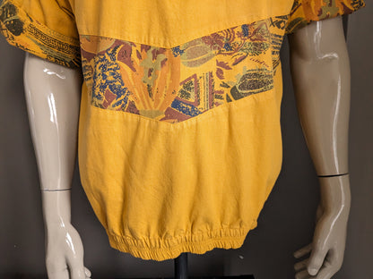 Vintage polo with elastic band. Dark yellow with print. Size L.