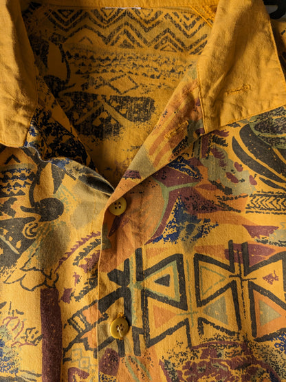 Vintage polo with elastic band. Dark yellow with print. Size L.