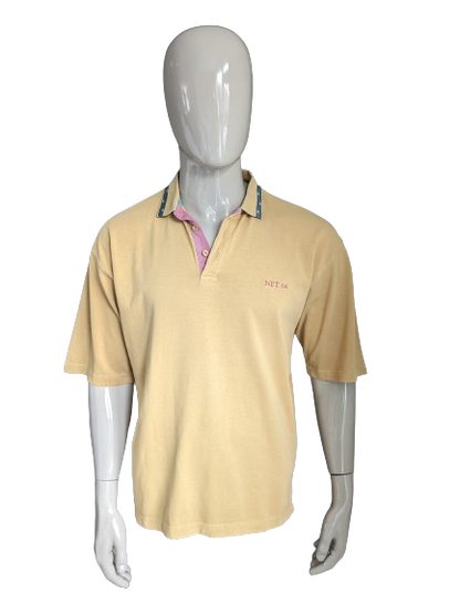 Vintage Net 64 Polo. Jaune de couleur moutarde. Taille l / xl.