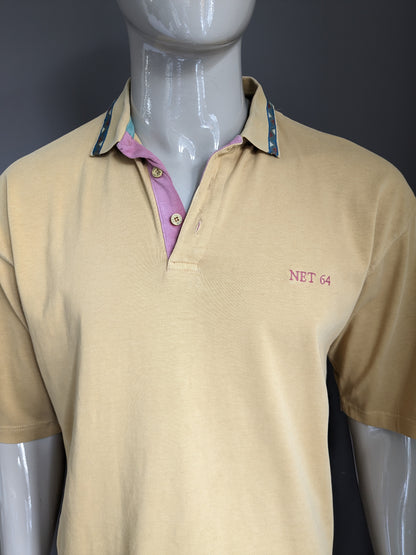 Vintage Net 64 Polo. Jaune de couleur moutarde. Taille l / xl.