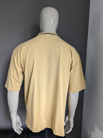 Vintage Net 64 Polo. Jaune de couleur moutarde. Taille l / xl.