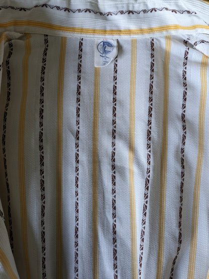 Camisa de los 70 vintage con cuello puntual. Amarillo marrón blanco rayado. Talla L.