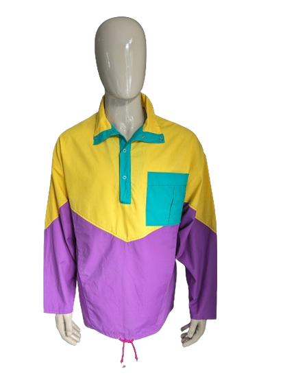 Pull Sport Funline Vintage avec goujons de presse. Couleur violette vert jaune. Taille xl.