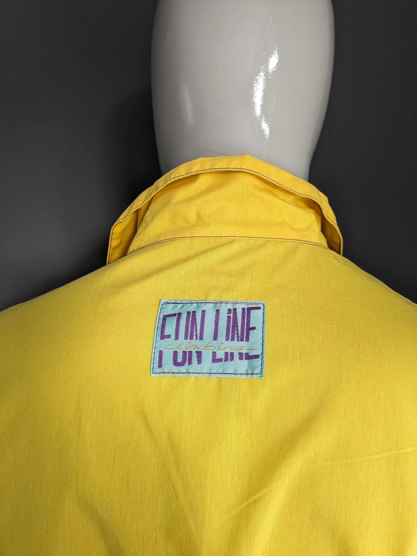 Vintage funline sport sweater with press studs. Yellow green purple colored. Size XL.