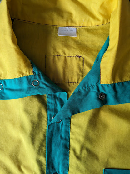 Vintage funline sport sweater with press studs. Yellow green purple colored. Size XL.