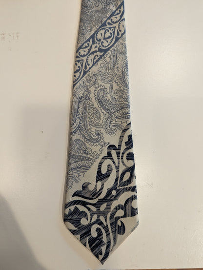 Vintage Brother's hand made polyester tie. Blue gray light brown motif.