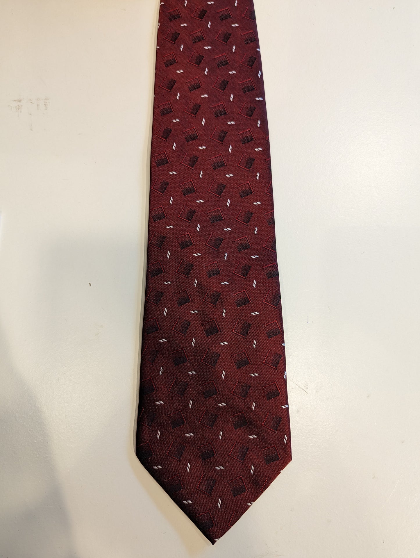 Vintage kai long hand made silk tie. Red black and white motif.