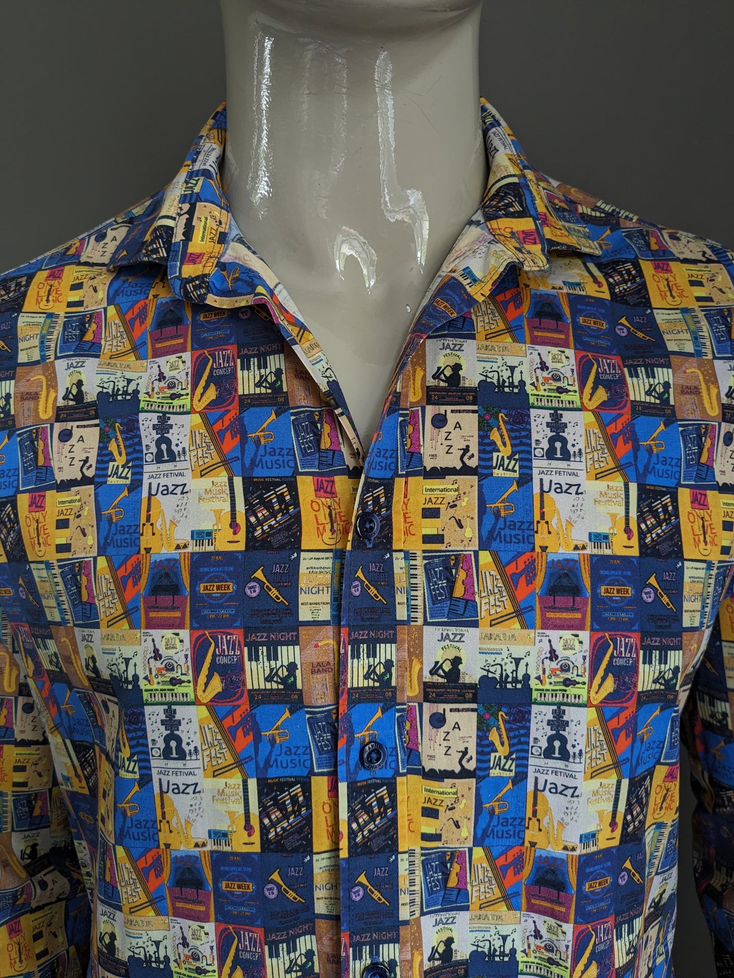 A Fish Named Fred shirt. Yellow blue red colored jazz print. Size M.