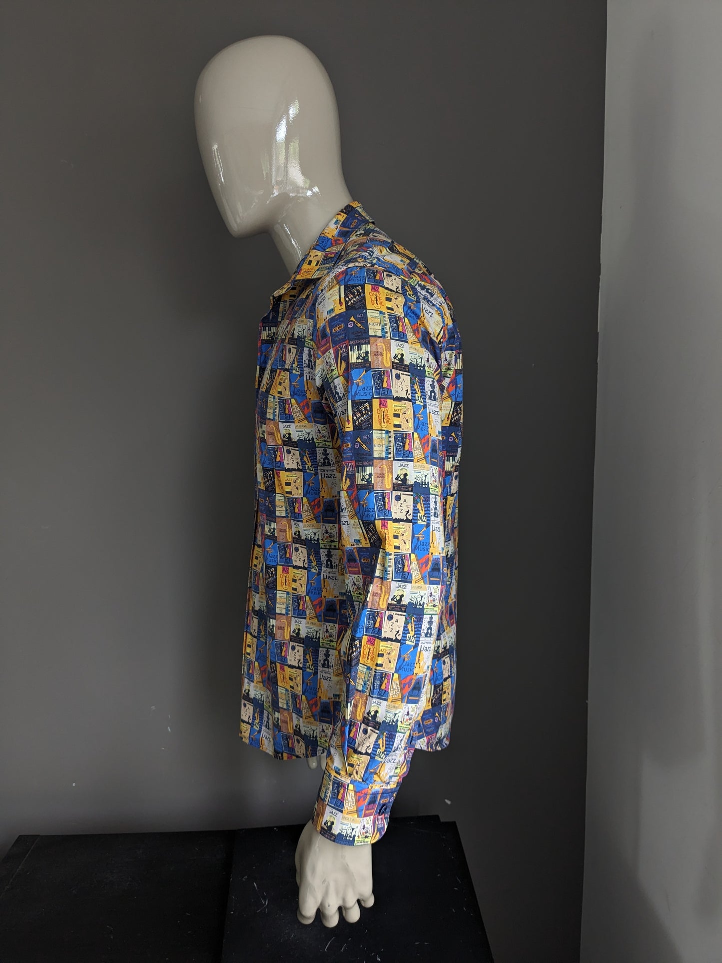 A Fish Named Fred shirt. Yellow blue red colored jazz print. Size M.