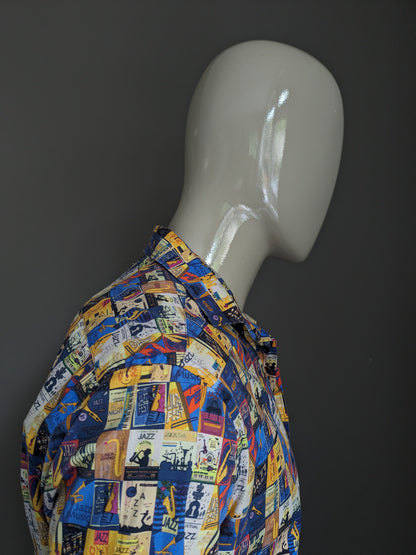 A Fish Named Fred shirt. Yellow blue red colored jazz print. Size M.