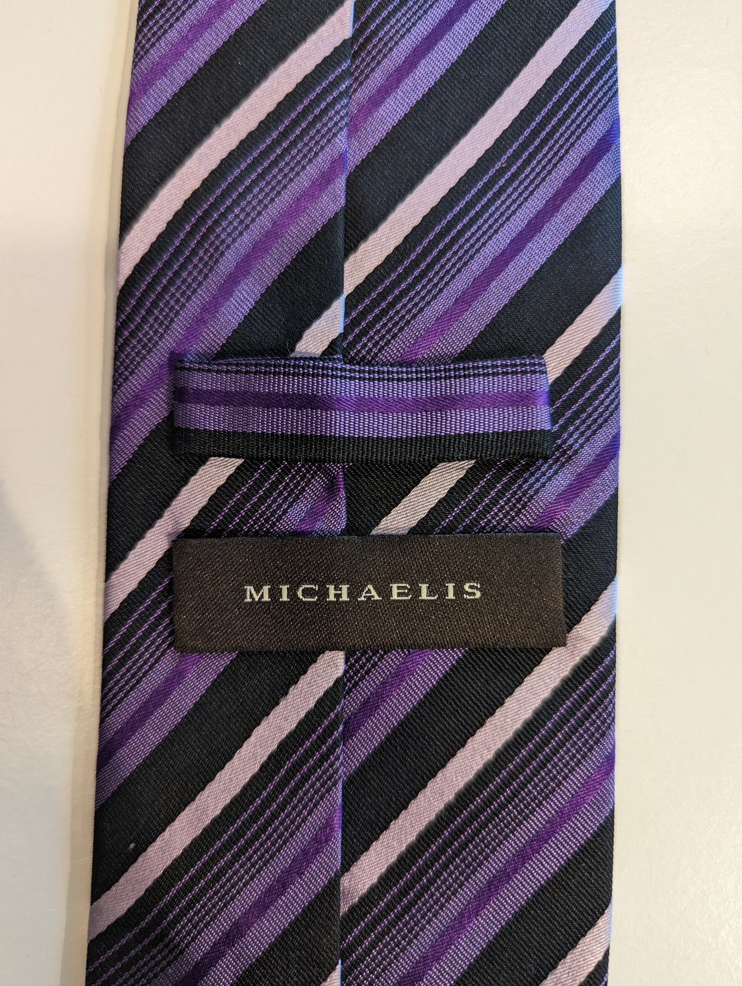 Michaelis silk tie. Purple black and white striped.