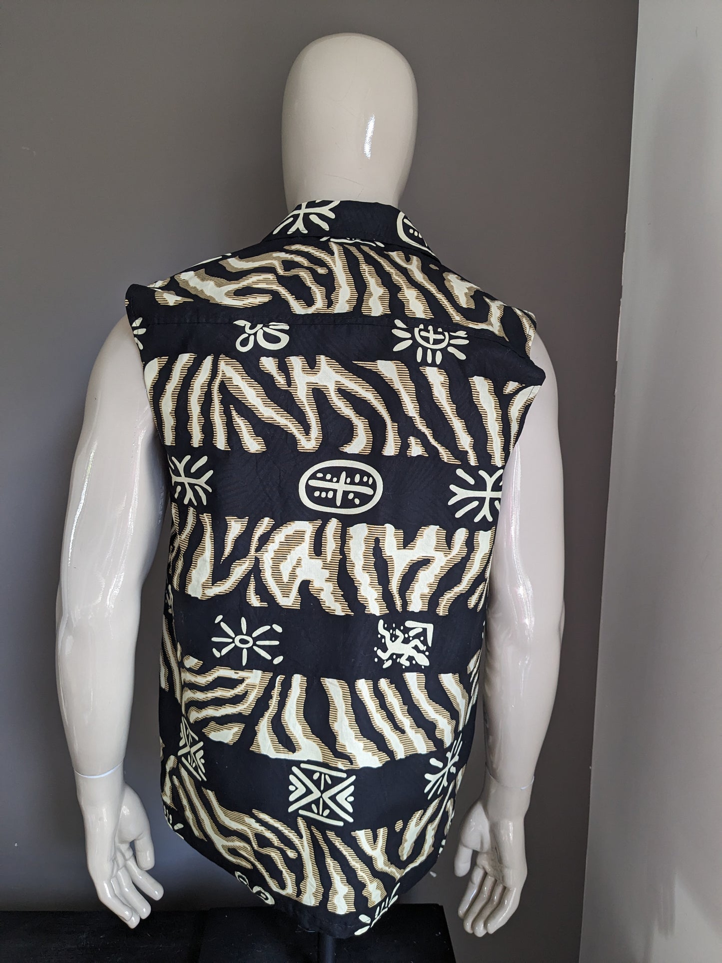 Sleeveless shirt. Black yellow beige African print.  Size M / L.