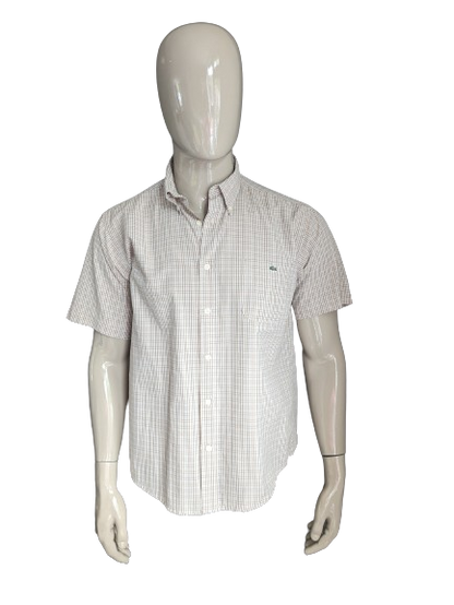 Camicia lacosta vintage manica corta. Blu marrone controllato. Dimensione 42 / L.