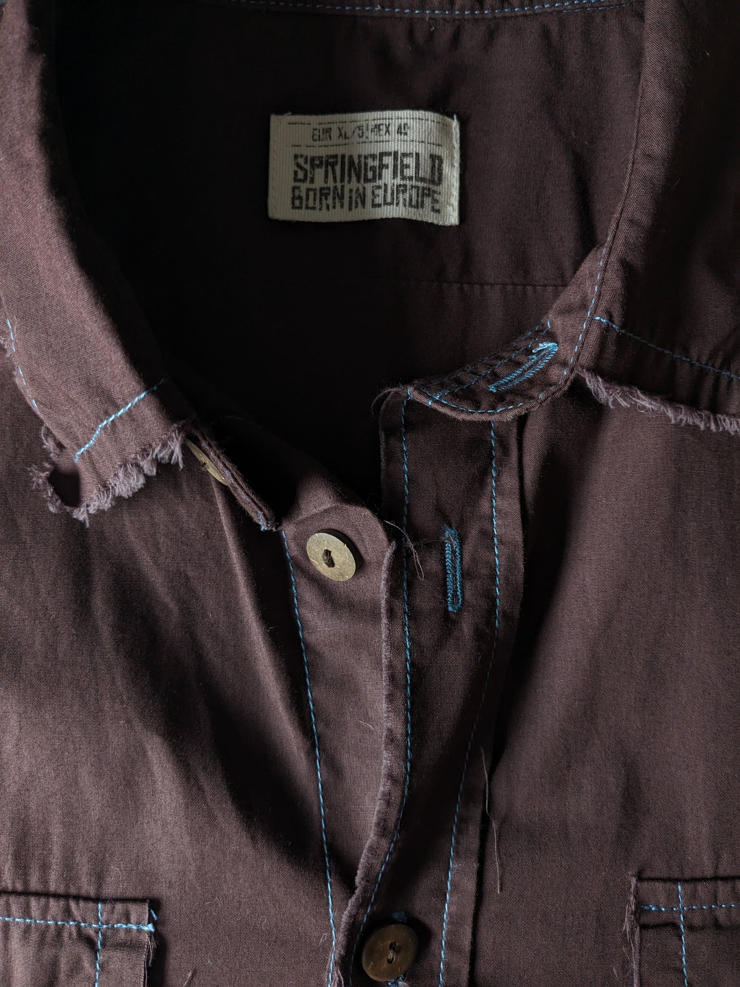 Springfield Shirt short sleeve. Brown with blue seams and frayed edges. Size XL.