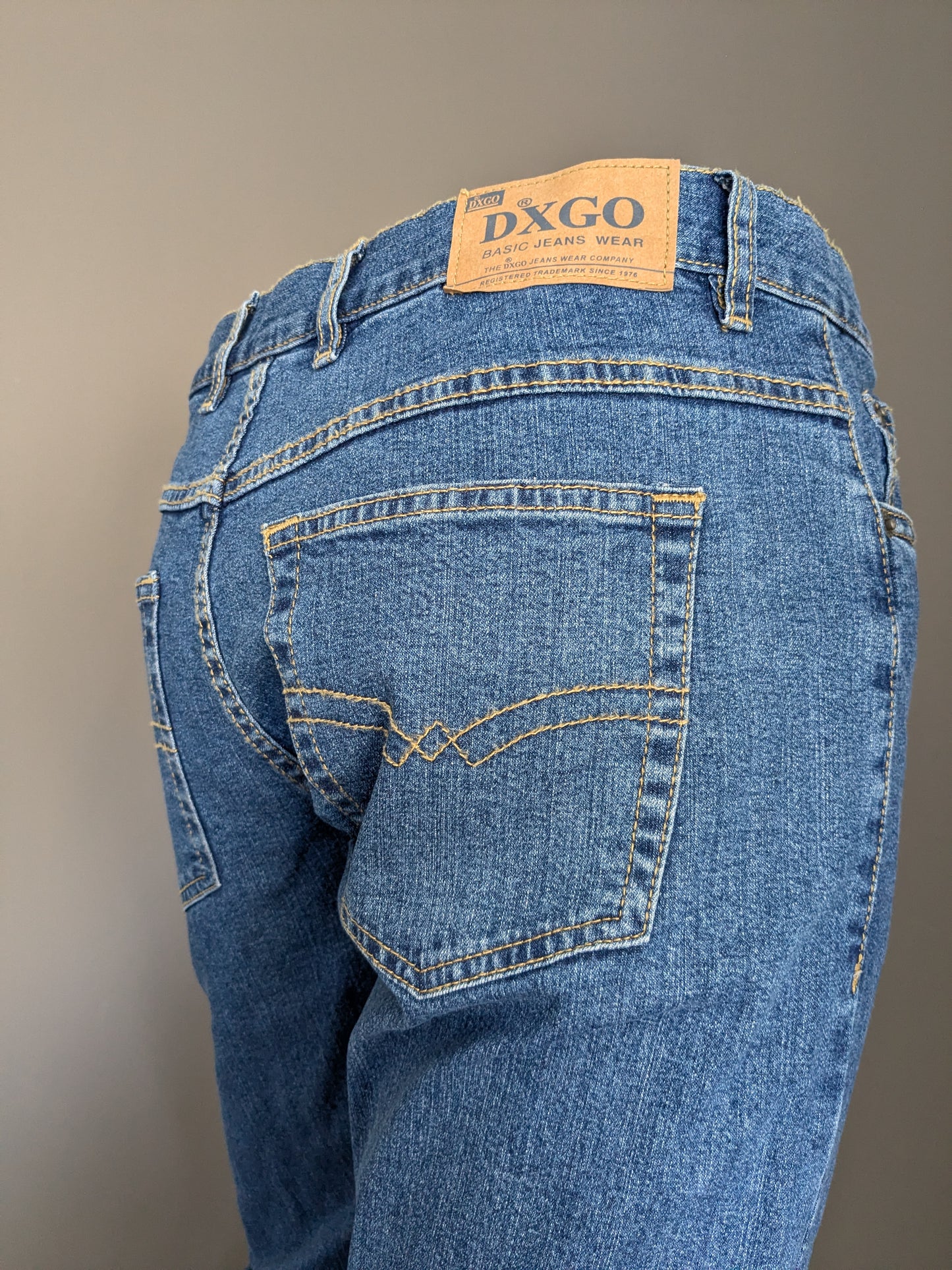 Jeans dxgo. Colorato blu. Dimensione W33 - L 34. Allungamento.