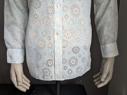 Belle chemise Zornica des années 70 avec collier. Motif de fleur vert blanc léger. Taille M.