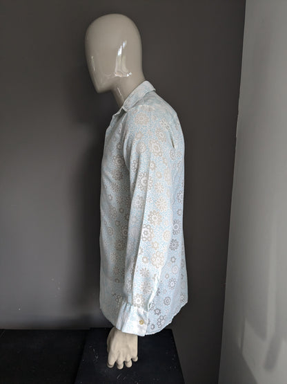 Belle chemise Zornica des années 70 avec collier. Motif de fleur vert blanc léger. Taille M.