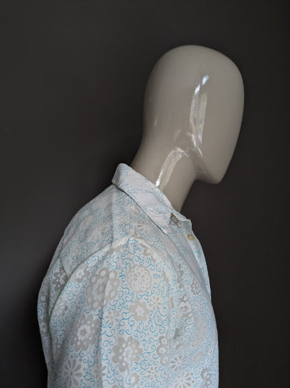 Belle chemise Zornica des années 70 avec collier. Motif de fleur vert blanc léger. Taille M.