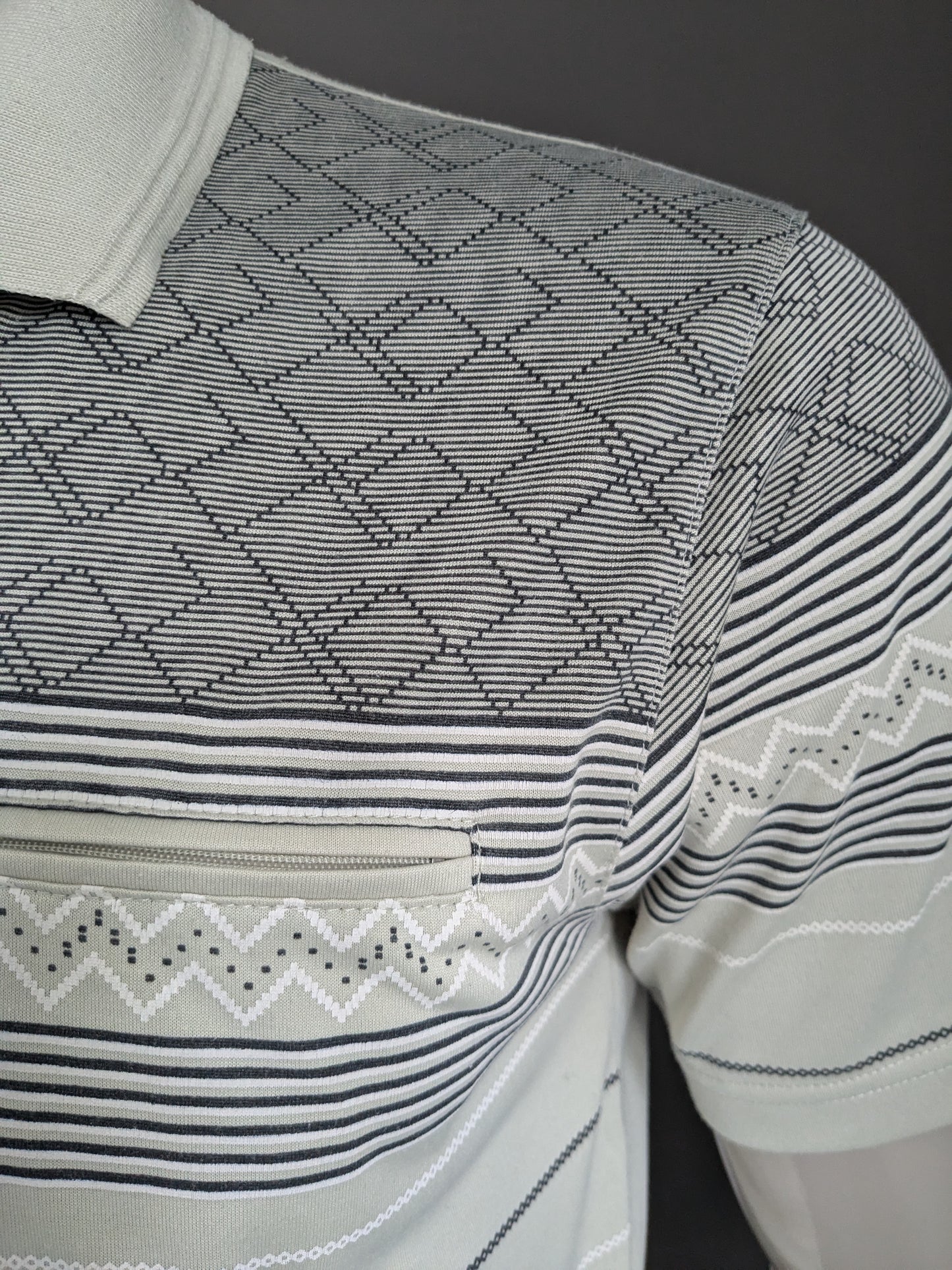 Polo de línea dura vintage con banda elástica y cremallera. Motif blanco de color gris claro. Tamaño M / L.