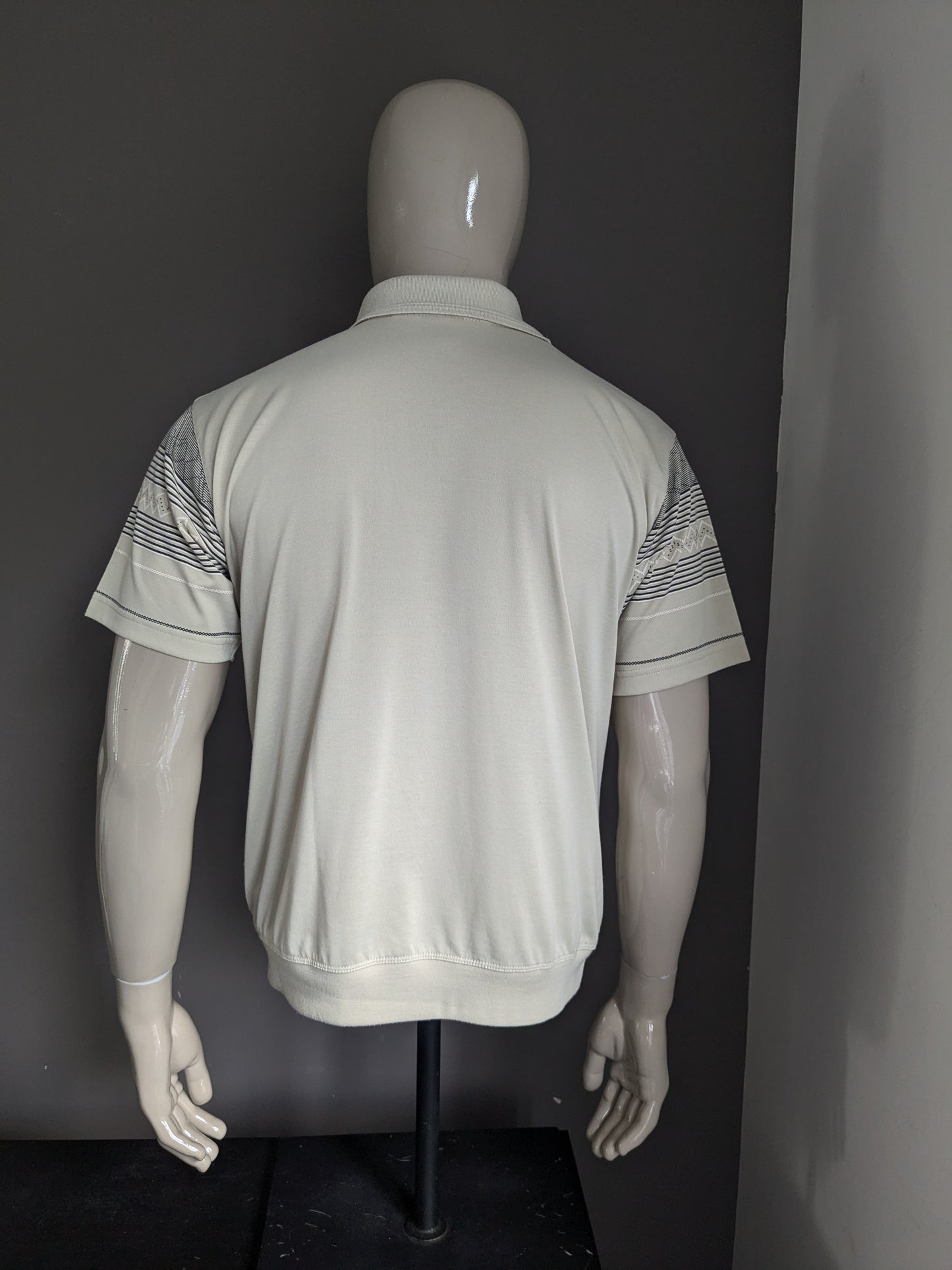 Polo de línea dura vintage con banda elástica y cremallera. Motif blanco de color gris claro. Tamaño M / L.