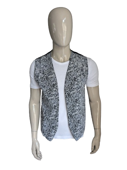 Vintage tweezijdig gilet zonder sluiting. Grijs zwarte print. Maat L.