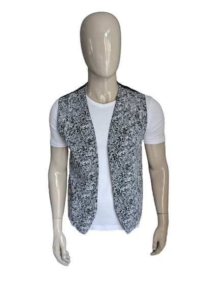 Vintage tweezijdig gilet zonder sluiting. Grijs zwarte print. Maat L.