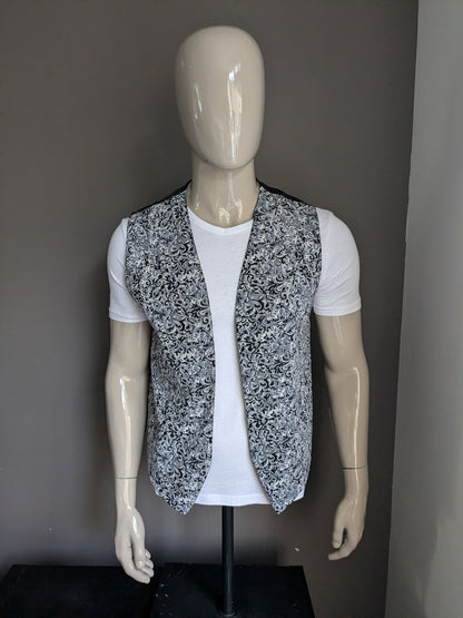 Vintage tweezijdig gilet zonder sluiting. Grijs zwarte print. Maat L.