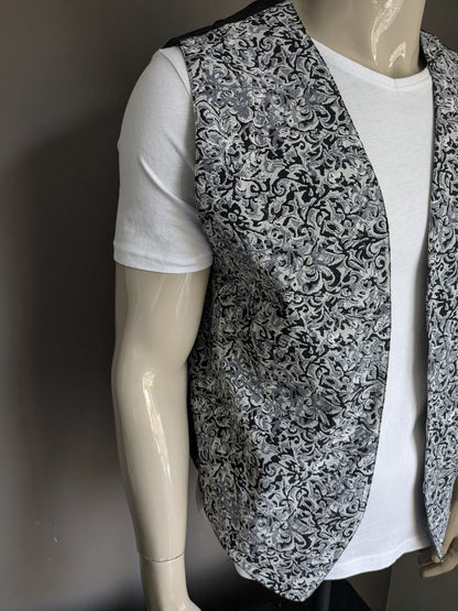 Vintage tweezijdig gilet zonder sluiting. Grijs zwarte print. Maat L.