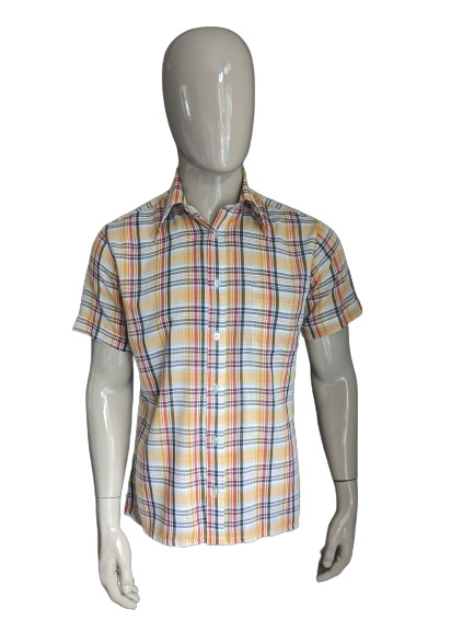 Vintage 70's shirt with point collar and short sleeve. Yellow red black checked. Size L.