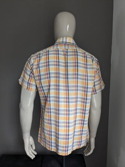 Vintage 70's shirt with point collar and short sleeve. Yellow red black checked. Size L.