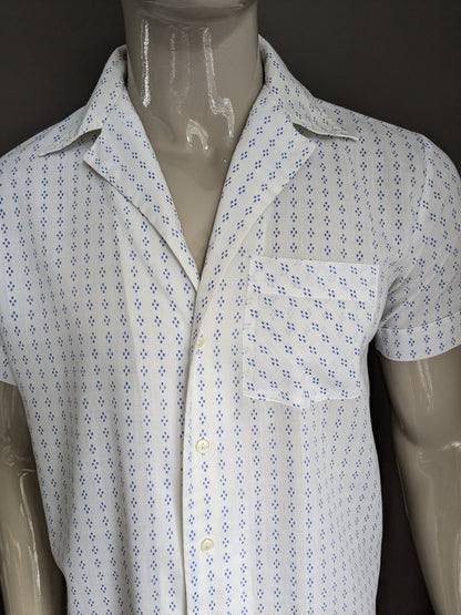 Manche courte de la chemise Fekon des années 70. Impression blanche bleue. Taille L.