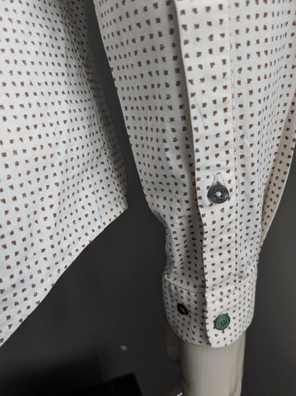 Camisa de hierro fundido. Impresión beige marrón. Tamaño M. estiramiento.