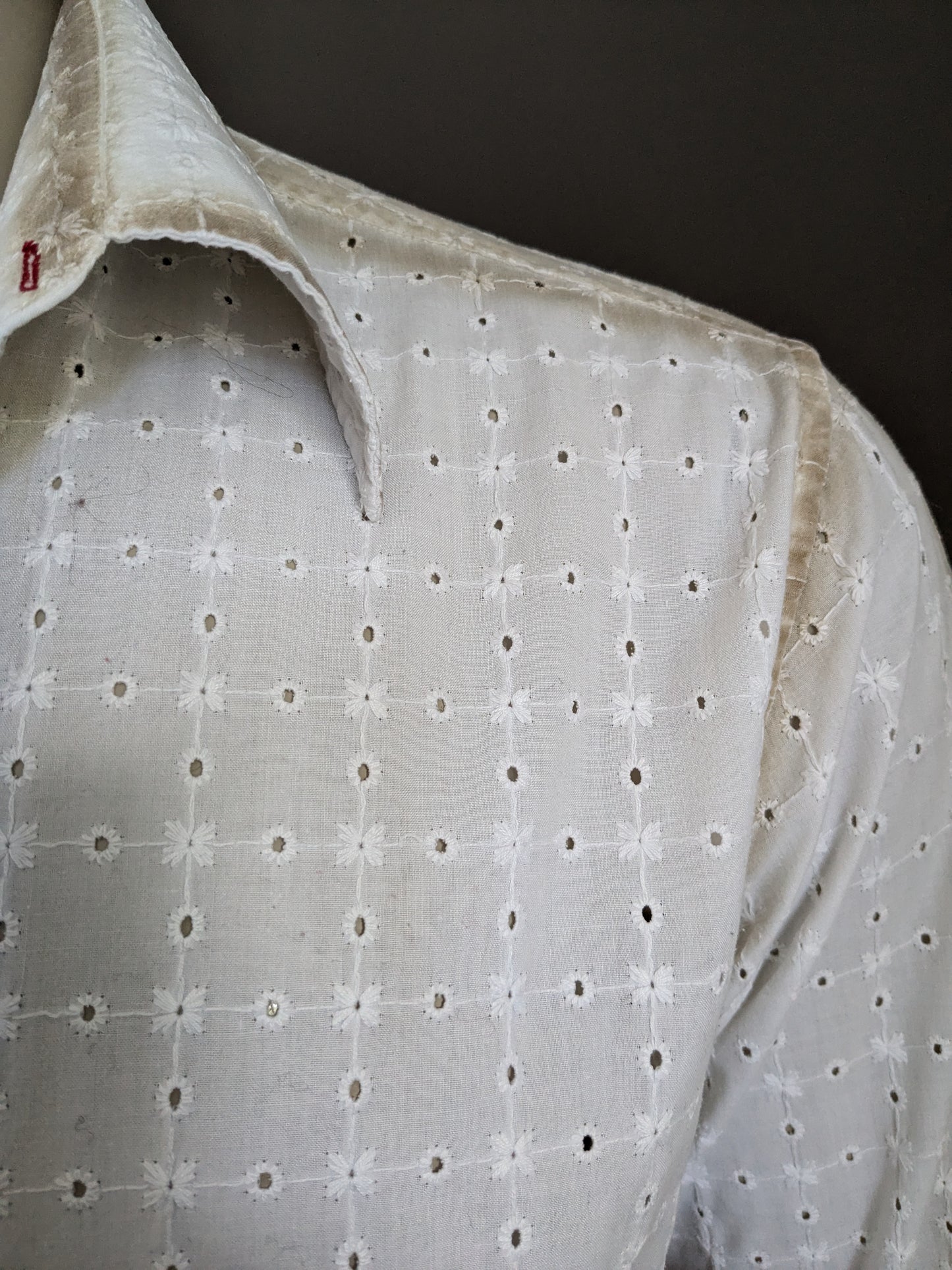 It's noize shirt. White beige holes motif. Size XL.