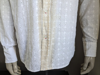 It's noize shirt. White beige holes motif. Size XL.