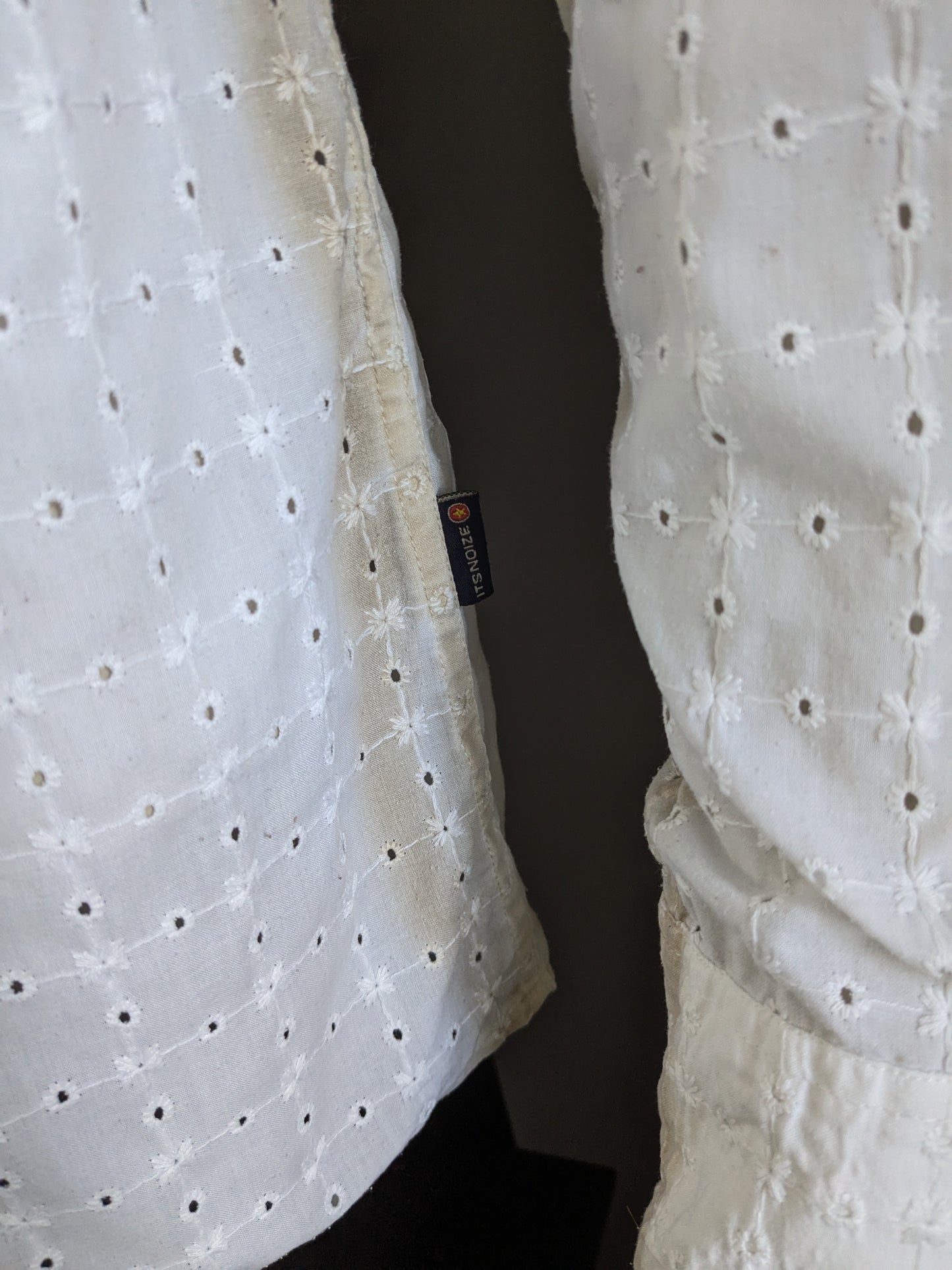 It's noize shirt. White beige holes motif. Size XL.